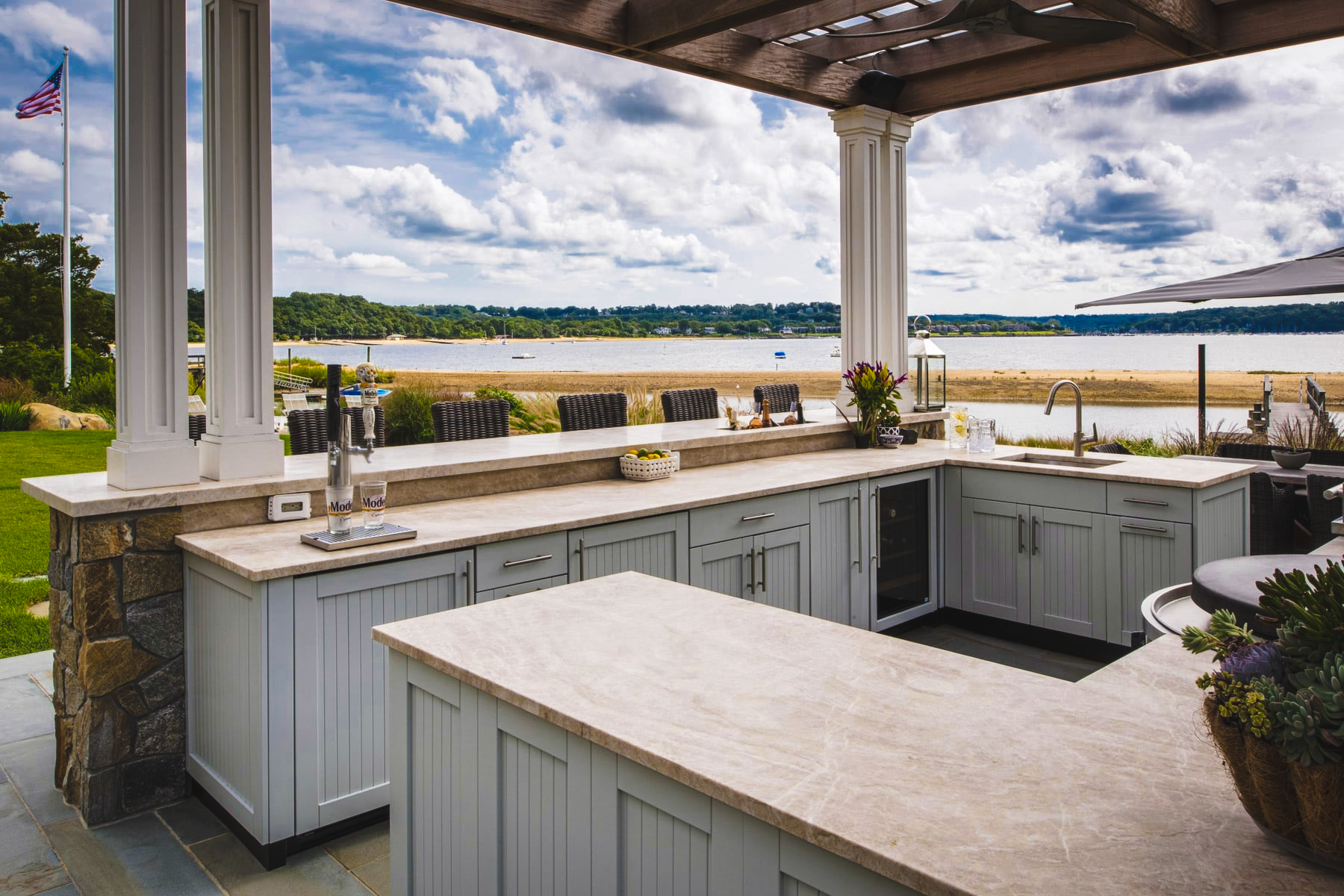 Waterfront outdoor kitchen with stone countertops